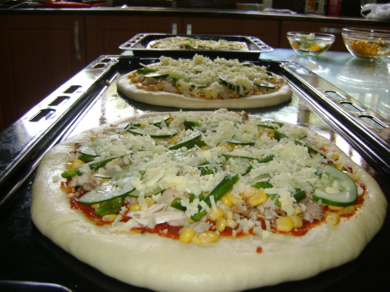 Lastly topping with Mozzarella cheese and assembly of the three pizzas
